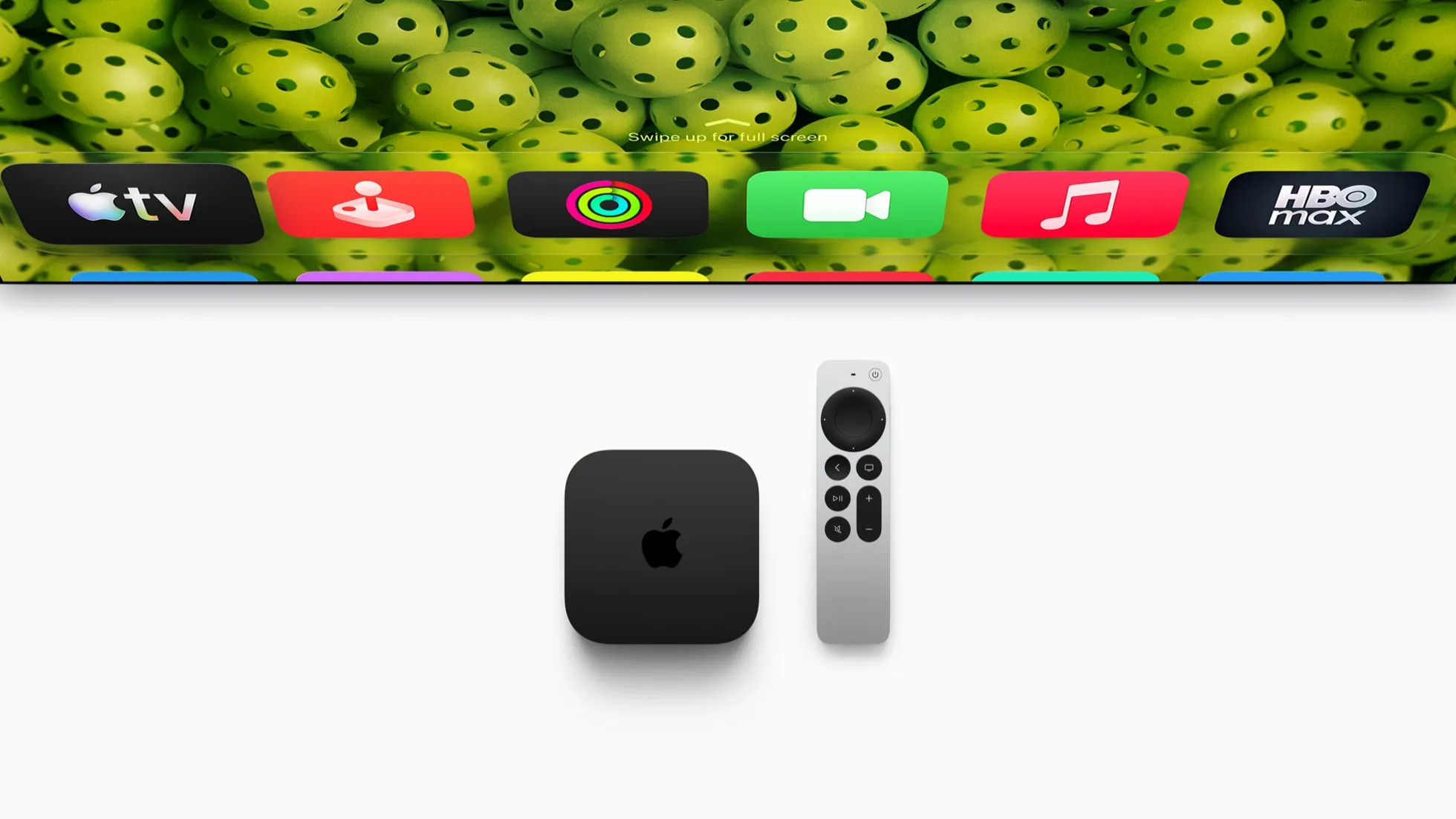 The new Apple TV 4K next to the Siri Remote, below a row of app icons on a TV screen