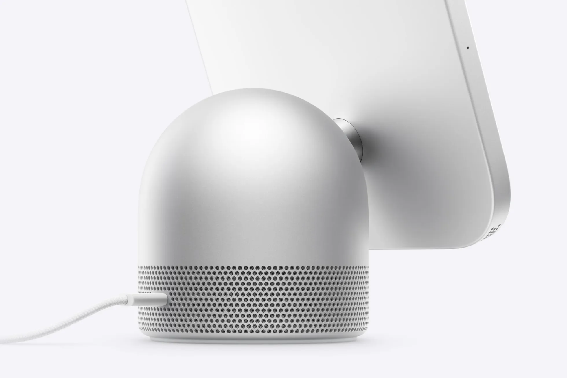 The back of Apple HomeView: a silver dome-shaped speaker with a USB-C cable, and the display on a hinge