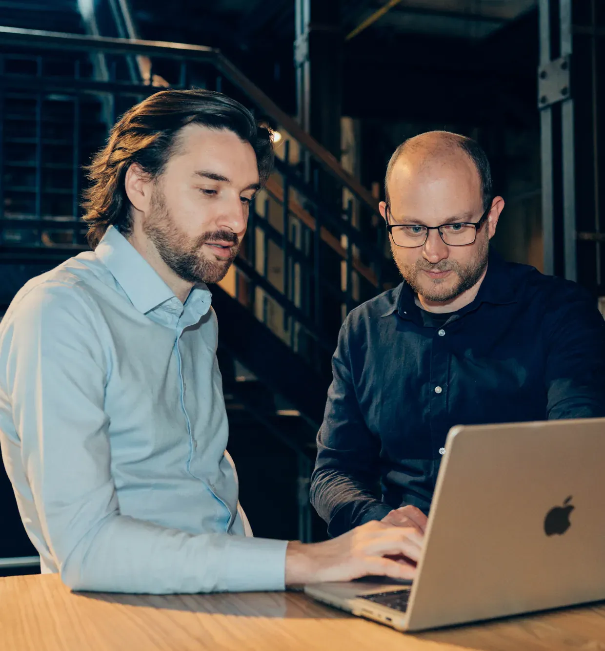Raf and Gunther looking at the same screen while working something out