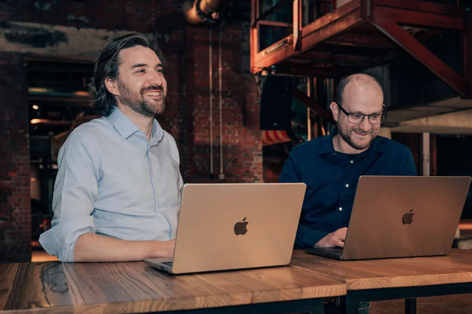 Raf and Gunther working on their MacBooks